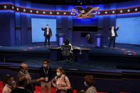 Mock debaters perform onstage as preparations take place for the second Presidential debate at Belmont University, Wednesday, Oct. 21, 2020, in Nashville, Tenn. President Donald Trump and Democratic presidential candidate, former Vice President Joe Biden are scheduled to debate Thursday, Oct. 22. (AP Photo/Patrick Semansky)