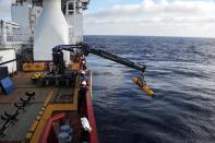 This image taken on April 14, 2014 and received on April 15, 2014 from the US Navy shows operators aboard ADF Ocean Shield moving US Navy's Bluefin-21 into position for deployment in the search of missing Malaysia Airlines flight MH370