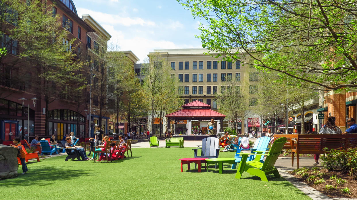 Rockville, Maryland / USA - April 2019: People enjoying the market square in the Rockville Town Center.
