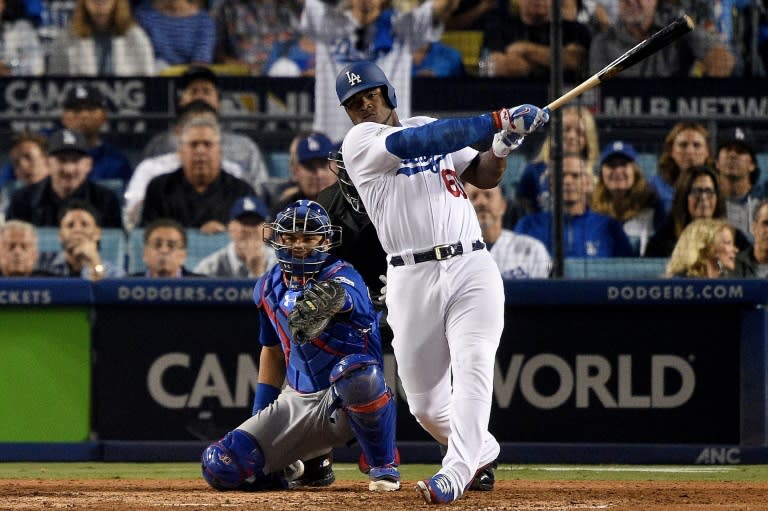 Yasiel Puig of the Los Angeles Dodgers hits a solo home run against Mike Montgomery of the Chicago Cubs during the 7th inning in Game One of the National League Championship Series, at Dodger Stadium in Los Angeles, California, on October 14, 2017