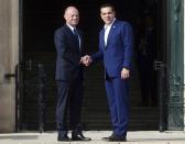 Greece Prime Minister Alexis Tsipras, right, shakes hands with Malta Prime Minister Joseph Muscat on the occasion of the Mediterranean Summit of Southern EU countries in Valetta, Malta, Friday, June 14, 2019. (AP Photo/Jonathan Borg)