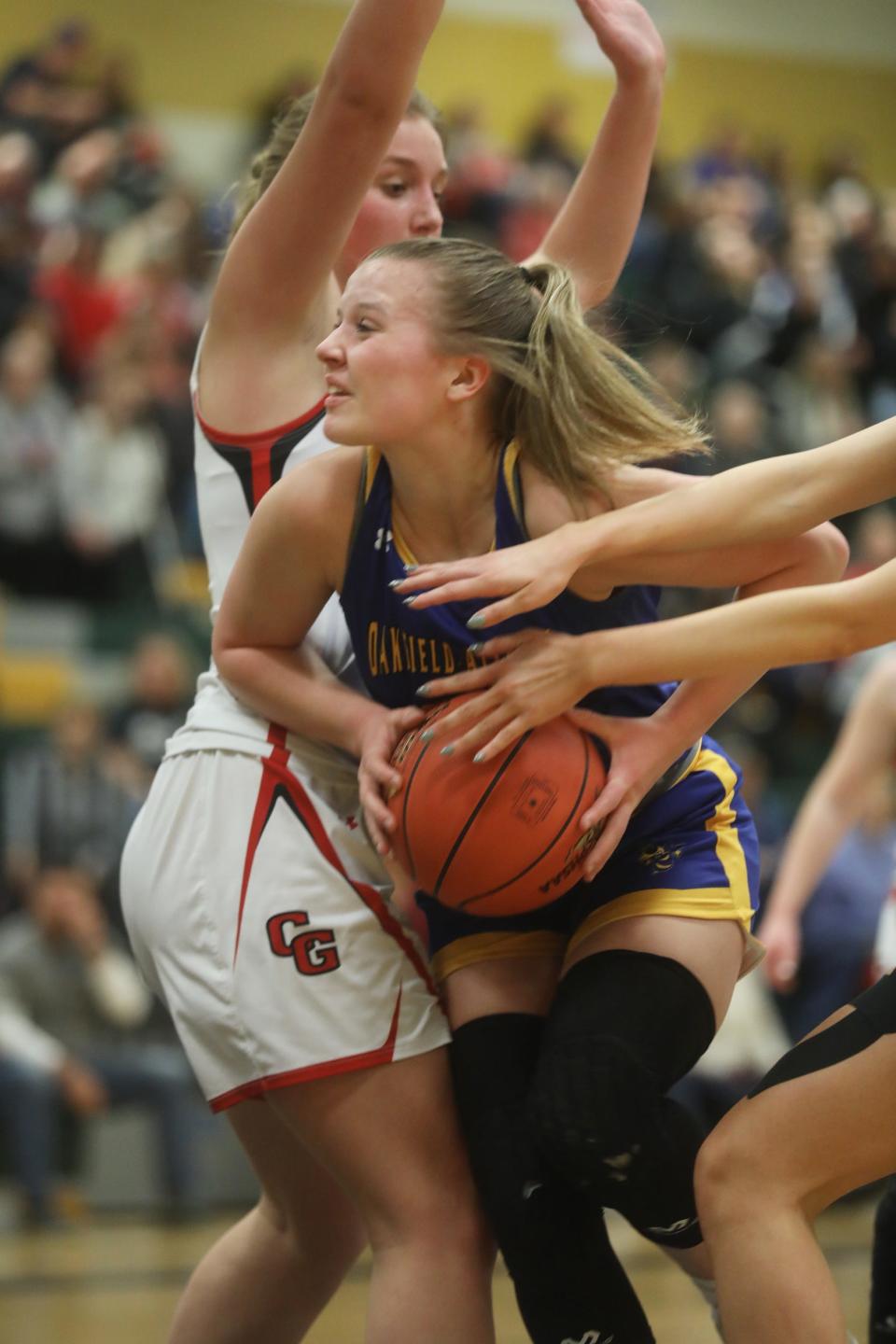 Oakfield-Alabama's Caitlin Ryan drives to the basket and gets  fouled during their Section V Class C1 championship game against Canisteo-Greenwood at Rush Henrietta High School.  