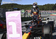 Red Bull driver Max Verstappen of the Netherlands leaves his car after he clocked the fastest time during the qualifying session at the Red Bull Ring racetrack in Spielberg, Austria, Friday, July 8, 2022. The Austrian F1 Grand Prix will be held on Sunday July 10, 2022. (Christian Bruna/Pool via AP)