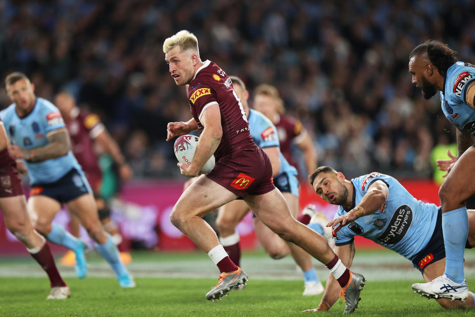 Seen here, QLD playmaker Cameron Munster runs with the ball in the State of Origin opener.