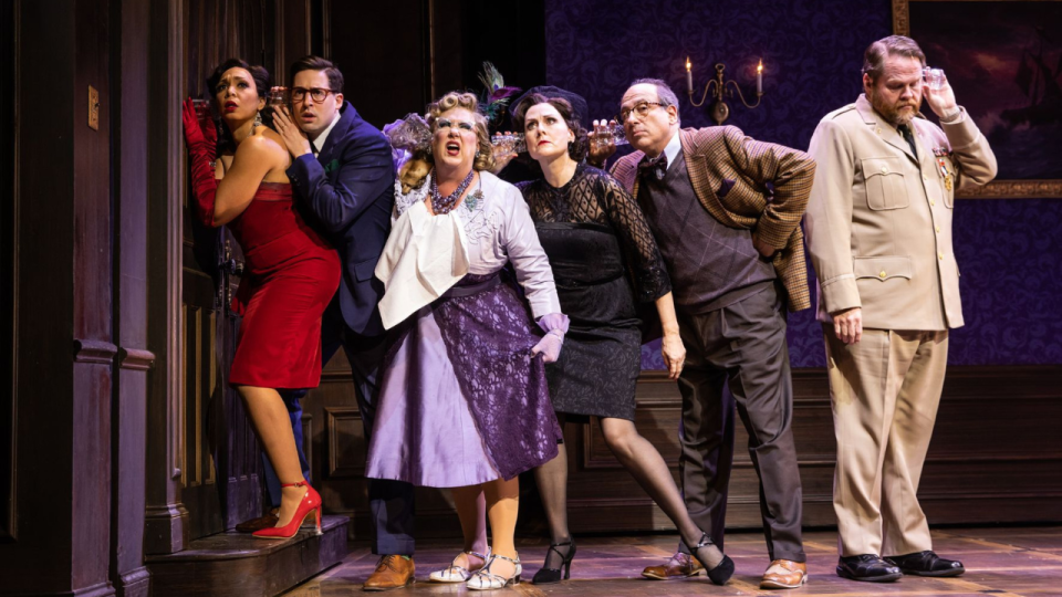 <em>Sarah Hollis as Miss Scarlet, Alex Mandell as Mr. Green, Kathy Fitzgerald as Mrs. Peacock, Donna English as Mrs. White, Michael Kostroff as Professor Plum, and John Treacy Egan as Colonel Mustard. (Photo by Evan Zimmerman/MurphyMade)</em>