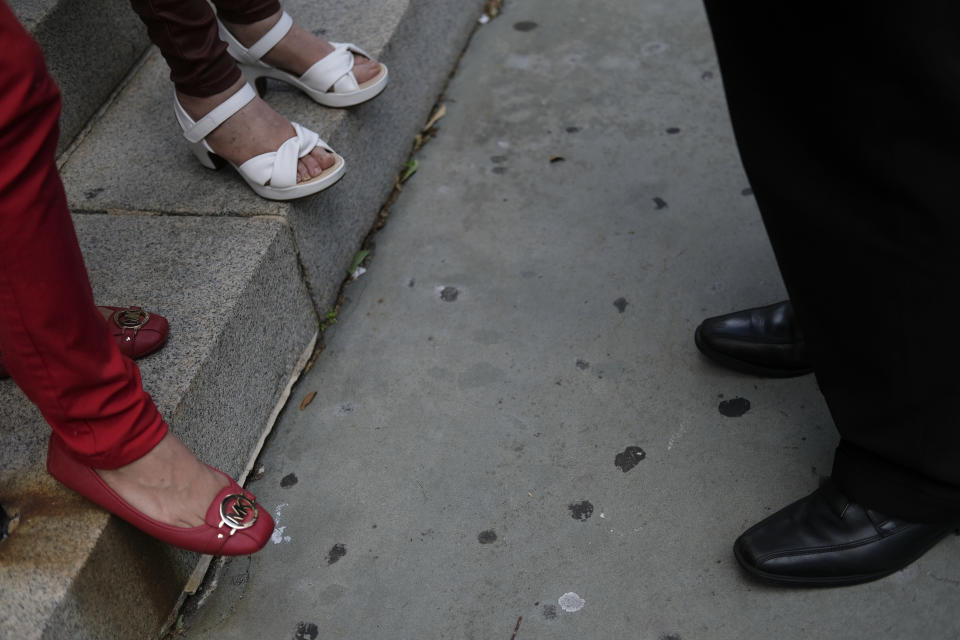 Parishioners stand outside St. Peter the Apostle Catholic Church in Reading, Pa., on Sunday, June 9, 2024. (AP Photo/Luis Andres Henao)