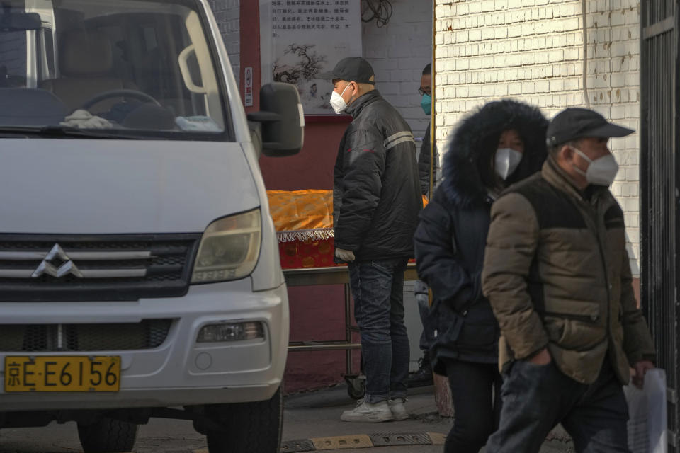 A body in a coffin is carried out of a mortuary of a hospital in Beijing, Friday, Jan. 6, 2023. China is seeking to minimize the possibility of a major new COVID-19 outbreak during this month’s Lunar New Year travel rush following the end of most pandemic containment measures.(AP Photo/Andy Wong)