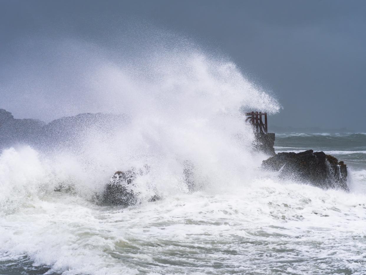 Waves hitting the rocks in Dublin, Ireland (Sryan Bruen/PA)