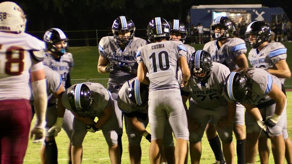 Clovis North quarterback Mario Cosma talks to his teammates during a high school football game against JSerra Catholic-San Juan Capistrano in Clovis, California on Friday, Sept. 15, 2023.