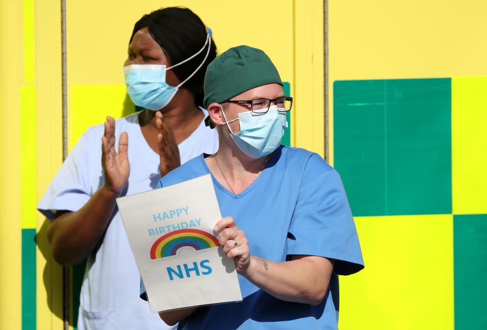 NHS staff outside the William Harvey Hospital in Ashford, Kent, join in the pause for applause to salute the NHS 72nd birthday. (Photo by Gareth Fuller/PA Images via Getty Images)