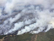 An aerial view from the helicopter of Alberta Premier Rachel Notley shows smoke rising from raging wildfires which caused the mandatory evacuation of Fort McMurray, Alberta, Canada May 4, 2016. Cheryl Oates/Government of Alberta/Handout via REUTERS