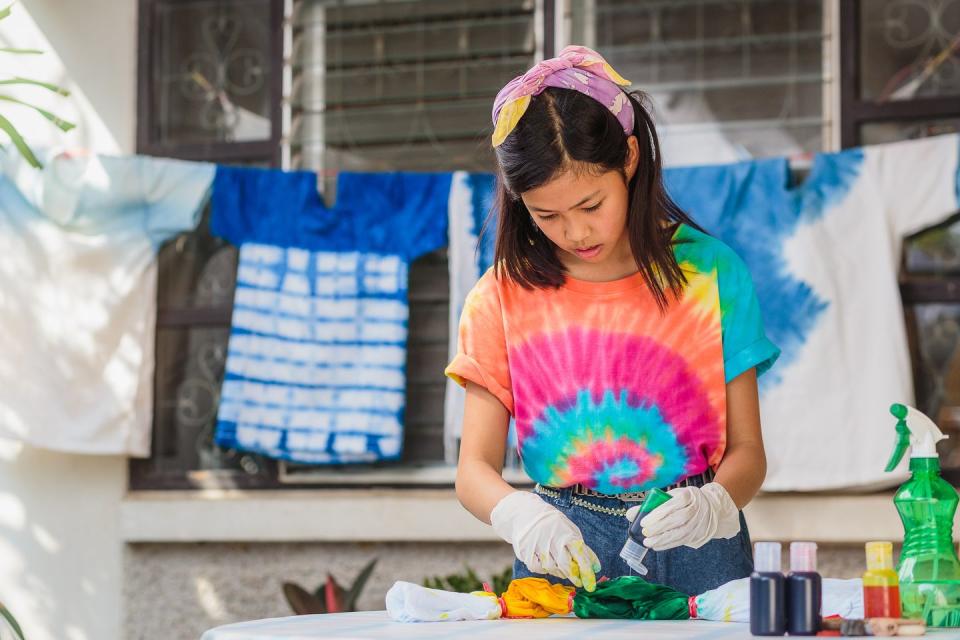 young asian girl enjoy making tie dye clothes at home fun activities for kids