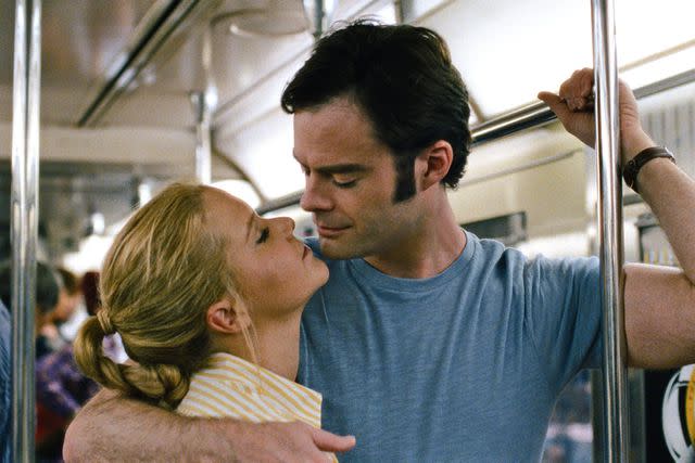 <p>Moviestore/Shutterstock</p> Amy Schumer and Bill Hader in <i>Trainwreck</i>, 2015