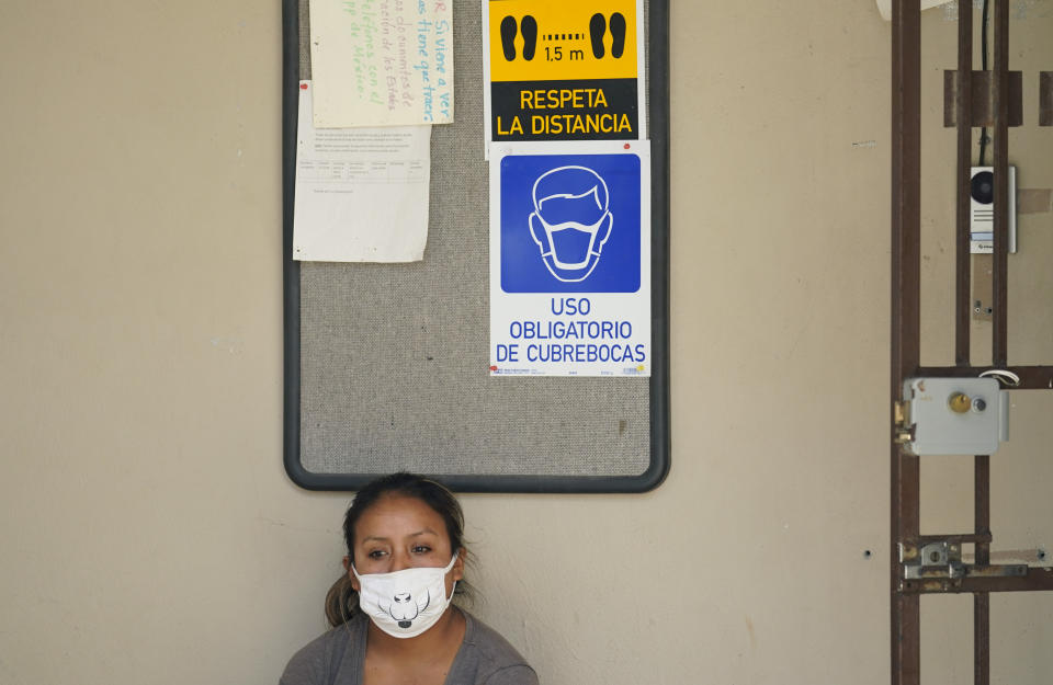 A woman seeking asylum in the United States and living at a camp in Matamoros, Mexico, waits for COVID-19 antibody test result at a clinic, Tuesday, Nov. 17, 2020. Led by U.S. military veterans, Global Response Management is staffed by volunteers primarily from the U.S. and paid asylum seekers who were medical professionals in their homelands. The group has treated thousands of migrants over the past year at two clinics in Matamoros, including one inside the camp. (AP Photo/Eric Gay)