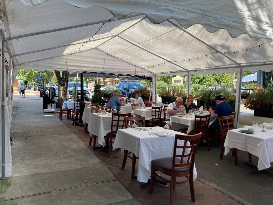 Tablecloth dining is available outside and inside at Toscano.