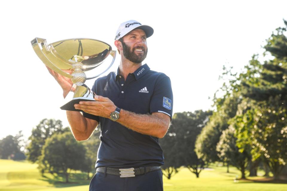 Dustin Johnson raises the FedEx Cup Trophy on the 18th green after the final round of the TOUR Championship at East Lake Golf Club on September 7, 2020, in Atlanta, Georgia. (Photo by <a class="link " href="https://sports.yahoo.com/ncaaf/players/320406" data-i13n="sec:content-canvas;subsec:anchor_text;elm:context_link" data-ylk="slk:Ben;sec:content-canvas;subsec:anchor_text;elm:context_link;itc:0">Ben</a> Jared/PGA TOUR via Getty Images)