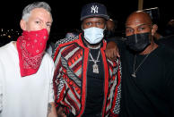 <p>50 Cent (center) hosts a party for Barry Mullineaux (left) on Thursday in Miami, Florida. </p>