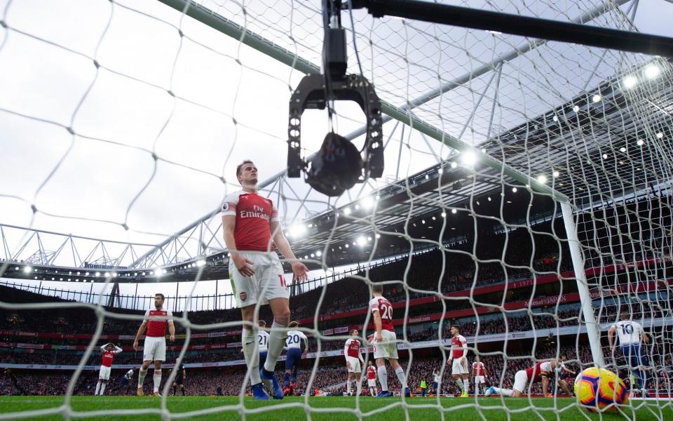 A remote-controlled goal camera films Rob Holding of Arsenal as he collects the ball from the net after Tottenham equalise - GETTY IMAGES