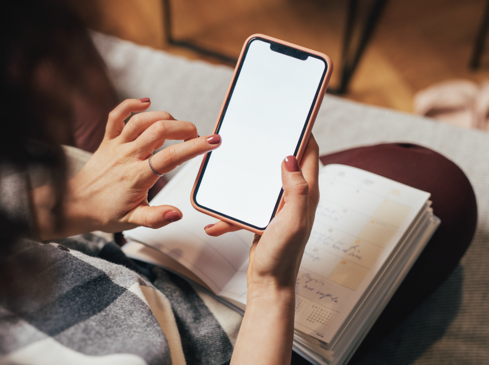 woman looking at her phone