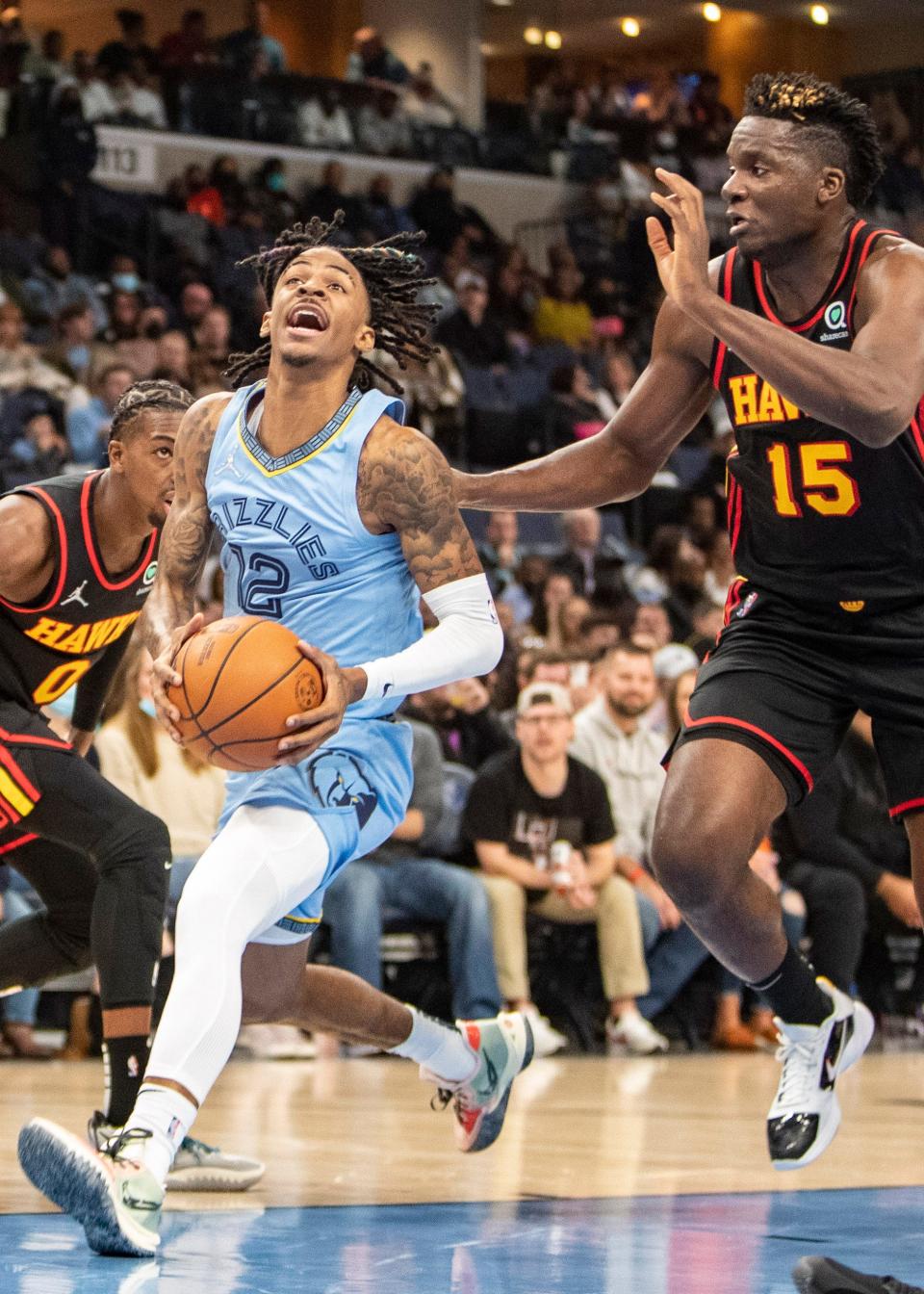 Memphis Grizzlies guard Ja Morant (12) goes up for a shot during their game at FedExForum on Friday, Nov. 26, 2021.