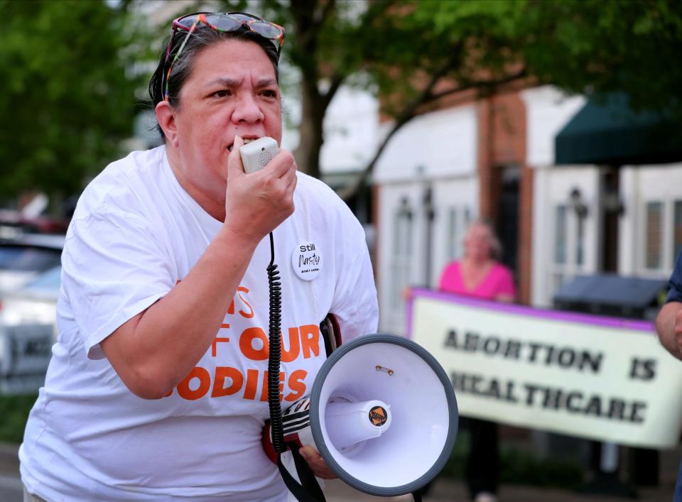 Darlene NeaL speaks over a megaphone about women's rights as she and other demonstrate on the Murfreesboro Public Square on Tuesday, May 3, 2022, opposing a leaked opinion from the U.S. Supreme Court that could possibly overturn Roe vs. Wade, and reverse legalized abortions in the U.S.