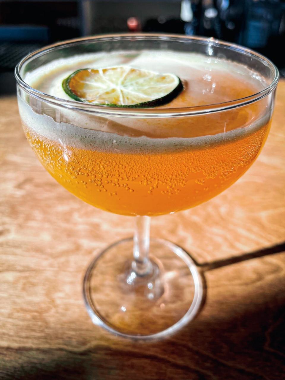 The Burning Passion Margarita at El Mero Taco in Cordova.  This smoky and sweet margarita is made with mezcal, passion fruit puree and smoked habanero.