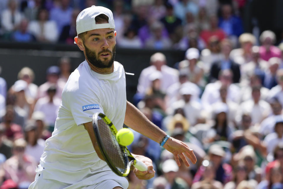 Britain's Jacob Fearnley plays a forehand return to Serbia's Novak Djokovic during their second round match at the Wimbledon tennis championships in London, Thursday, July 4, 2024. (AP Photo/Kirsty Wigglesworth)