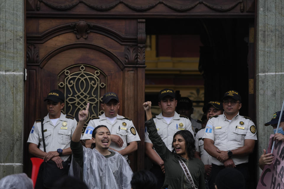 People protest in front of the Electoral Court building after Guatemala's highest court has suspended the releasing of official results of the June 25 general elections, in Guatemala City, Monday, July 3, 2023. (AP Photo/Moises Castillo)