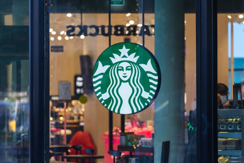 Starbucks Coffee Shop Famous Branches in Moscow. Logo Starbucks Close-Up.