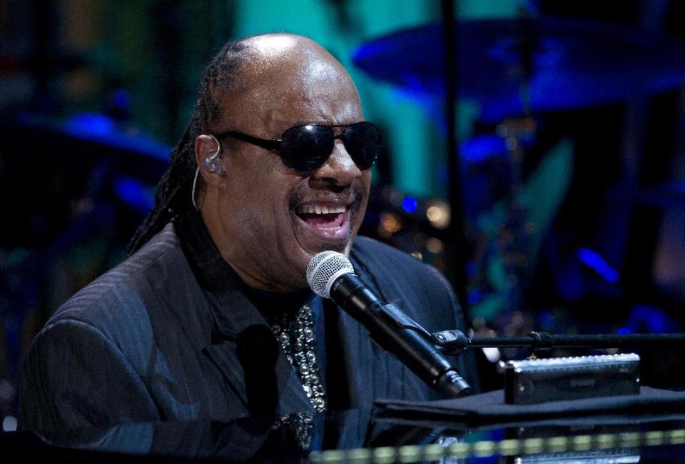 FILE - In a Wednesday, May 9, 2012 file photo, Stevie Wonder performs during the "In Performance at the White House" in the East Room of the White House in Washington, honoring songwriters Burt Bacharach and Hal David, recipients of the 2012 Library of Congress Gershwin Prize for Popular Song. Kelly Clarkson and fun. are just two of the acts who will perform during the upcoming inaugural festivities, which also includes Beyonce, James Taylor, Stevie Wonder, Katy Perry and dozens of others. (AP Photo/Carolyn Kaster, File)