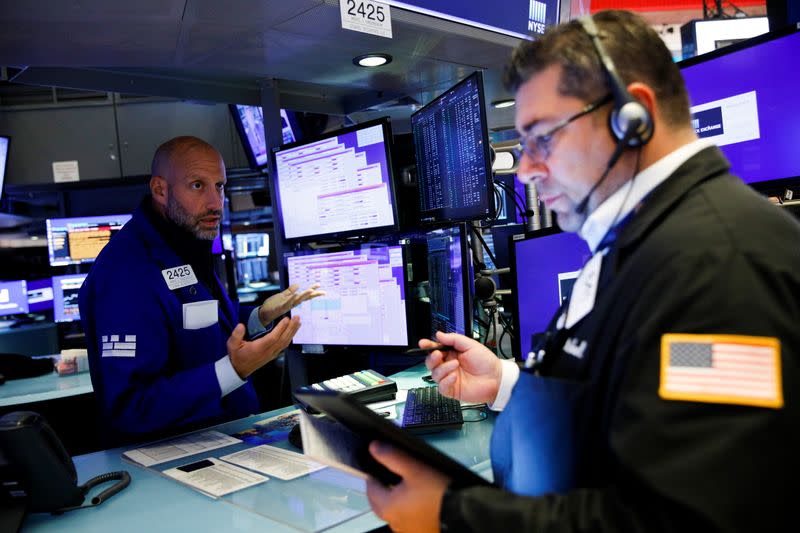 Traders work on the floor of the New York Stock Exchange (NYSE) in New York City