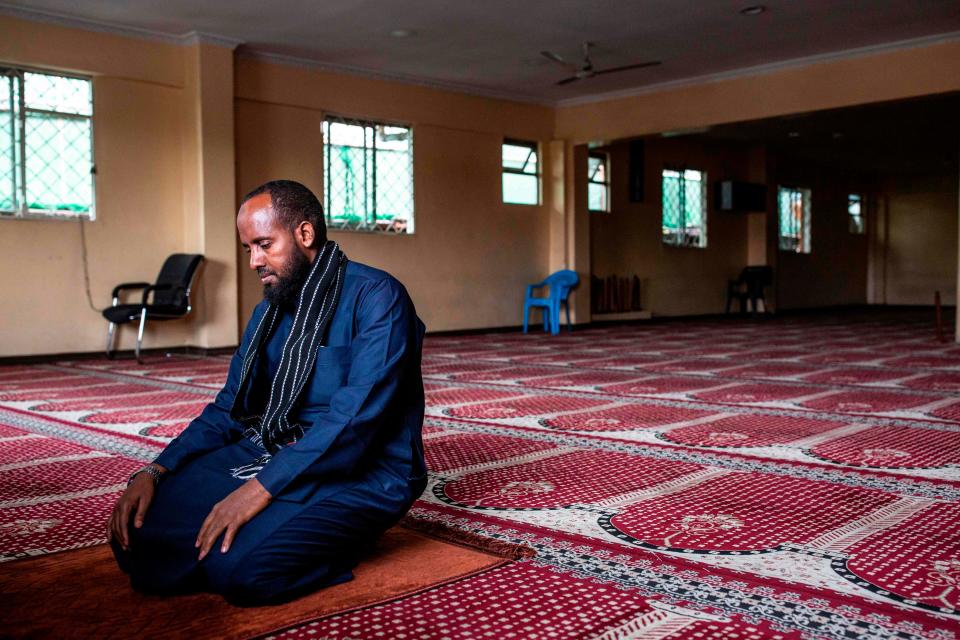 Imam Mohamed Yusuf prays alone at the Andalus Mosque in Eastleigh, Nairobi, on March 27, 2020, as the government banned mass prayers in mosques to curb the spread of the COVID-19 coronavirus.