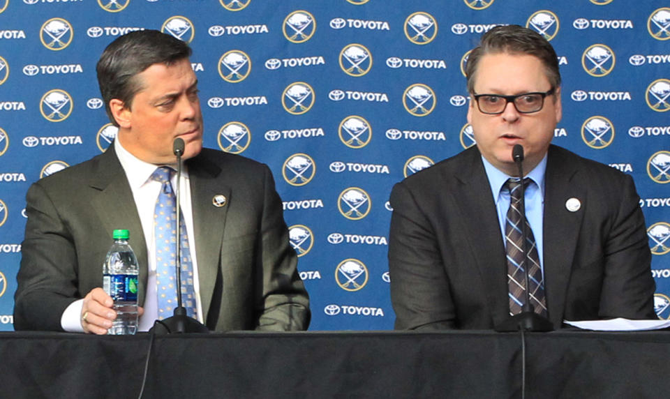 Tim Murray, right, addresses the media after being named as the new General Manager of the Buffalo Sabres, Thursday, Jan. 9, 2014, at First Niagara Center in Buffalo, N.Y. At left is Pat Lafontaine, President of Hockey Operations for the Sabres. (AP Photo/Nick LoVerde)