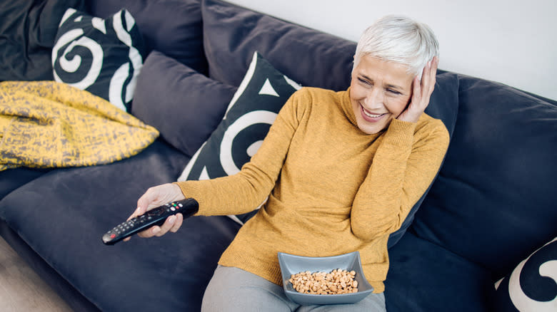 Woman eating peanuts