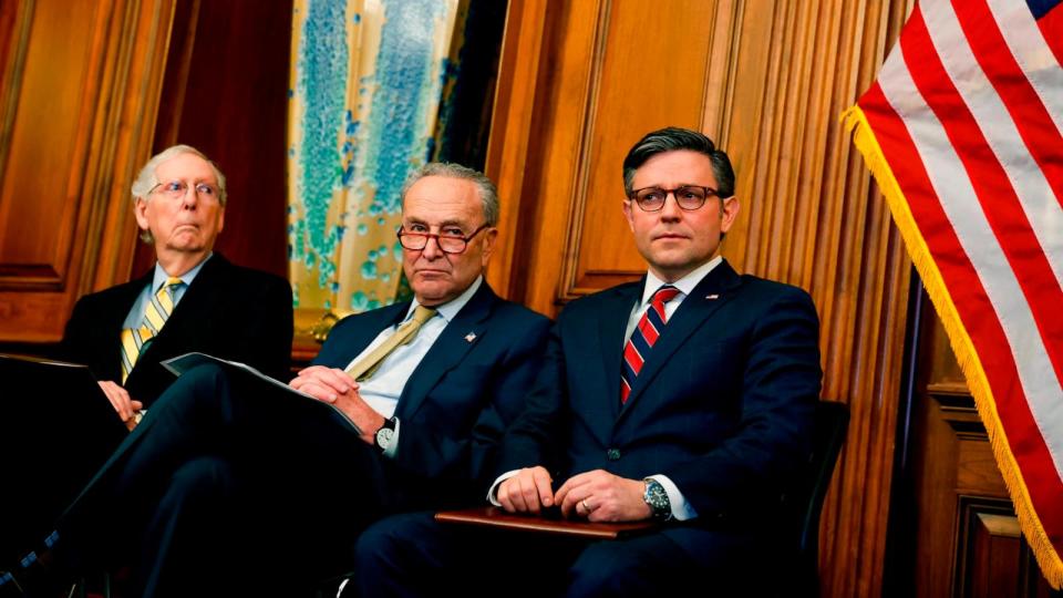 PHOTO: Senate Minority Leader Mitch McConnell, Senate Majority Leader Chuck Schumer and Speaker of the House Mike Johnson listen during during remarks at a Capitol Menorah lighting ceremony at the U.S. Capitol Building, Dec. 12, 2023 in Washington, DC. (Anna Moneymaker/Getty Images)