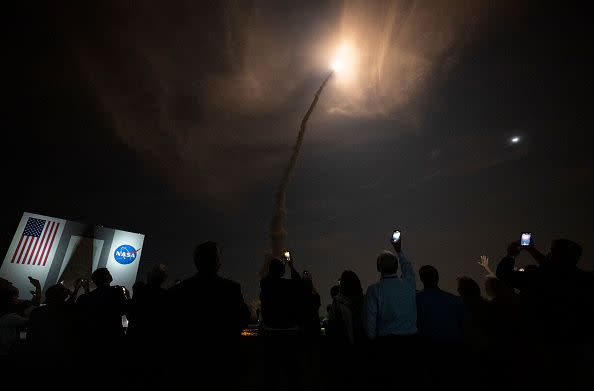 KENNEDY SPACE CENTER, FL - NOVEMBER 16:  In this handout provided by the U.S. National Aeronautics and Space Administration (NASA), guests watch the launch of NASAs Space Launch System rocket carrying the Orion spacecraft on the Artemis I flight test, from Launch Complex 39B on November 16, 2022, at the Kennedy Space Center, Florida. NASAs Artemis I mission is the first integrated flight test of the agencys deep space exploration systems: the Orion spacecraft, Space Launch System (SLS) rocket, and ground systems. SLS and Orion launched at 1:47am ET from Launch Pad 39B at the Kennedy Space Center. (Photo by Bill Ingalls/NASA via Getty Images)