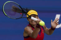 Emma Raducanu, of Great Britain, returns a shot to Belinda Bencic, of Switzerland, during the quarterfinals of the US Open tennis championships, Wednesday, Sept. 8, 2021, in New York. (AP Photo/Elise Amendola)