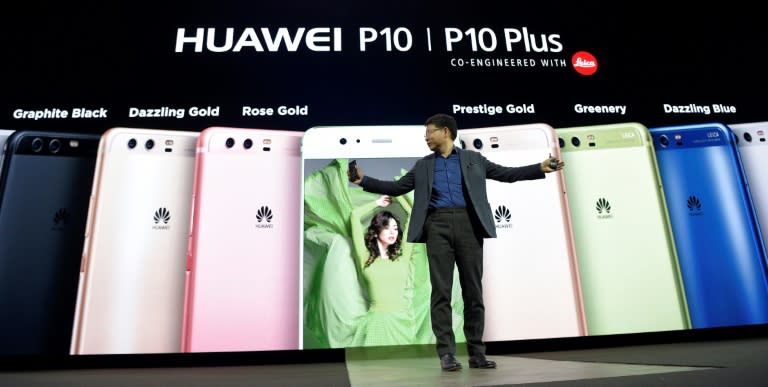 Huawei's CEO Richard Yu presents the new phone Huawei's P10 during a press conference on February 26, 2017 in Barcelona on the eve of the start of the Mobile World Congress