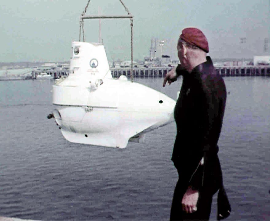 ** FILE ** In this March. 1966 photo taken from 16mm film footage from the National Archives in Washington D.C., an unidentified U.S. military diver guides an Alvin mini-submarine into the water near Palamares in south-eastern Spain, after a U.S. B-52 bomber crashed with a tanker plane during aerial refueling Jan 17, 1966, causing four hydrogen bombs to fall to earth in Palomares. Spain and the United States have reached an agreement on cleaning up radioactivity in the area, 40 years and 9 months after the accident news reports said Sunday. (AP Photo/National Archive Record Administration, Washington D.C. File.)