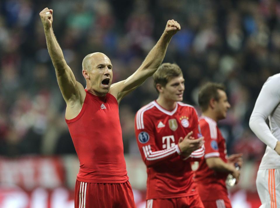 Bayern's Arjen Robben celebrates at the end of the Champions League quarterfinal second leg soccer match between Bayern Munich and Manchester United in the Allianz Arena in Munich, Germany, Wednesday, April 9, 2014. Bayern won 3-1 to win the tie 4-2 on aggregate. (AP Photo/Matthias Schrader)