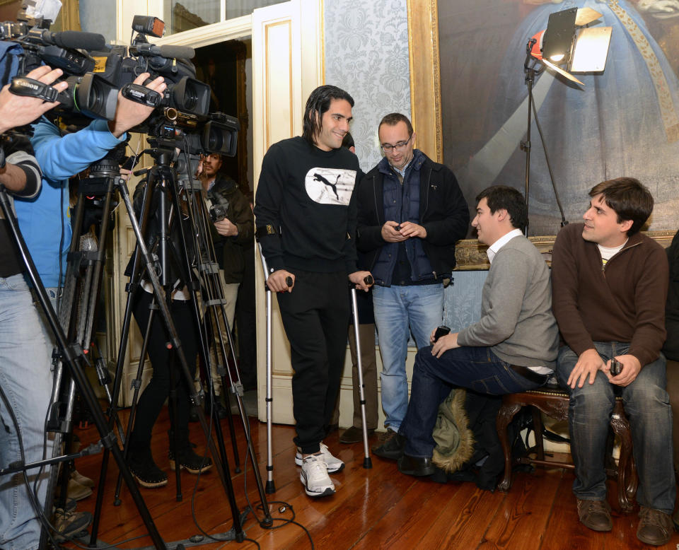 Colombian soccer star Radamel Falcao arrives for a press conference at the Trindade Hospital in Porto, Portugal, Monday, Jan. 27, 2014. Colombia and Monaco's striker Falcao is in a race against time to get fit for the World Cup in June after undergoing knee surgery Saturday, Jan. 25, with his doctor giving him a better than 50-50 chance of making it. (AP Photo/Paulo Duarte)