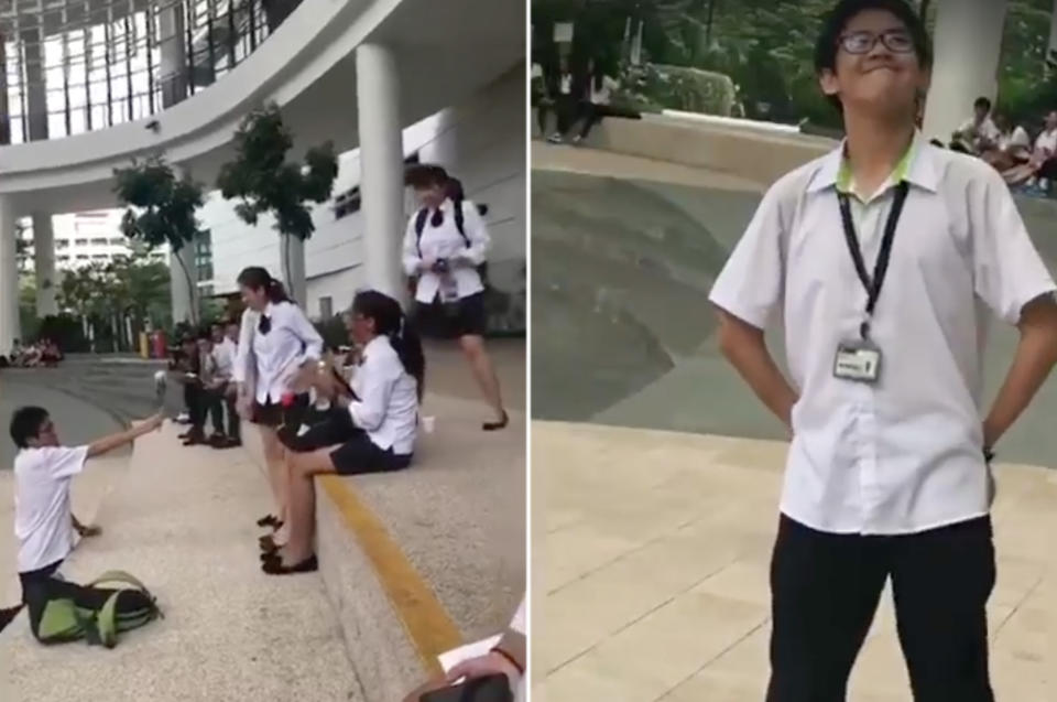 A student offers a girl a white rose at ITE College West. (Photo: Facebook)