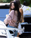 <p>Selena Gomez gives the cameras a smile on Friday while out in Los Angeles. </p>