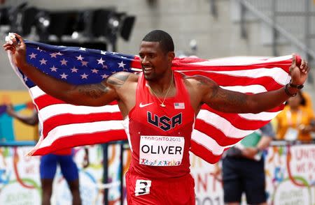 Jul 24, 2015; Toronto, Ontario, CAN; David Oliver of the United States reacts after winning the men's athletics 110m hurdles final during the 2015 Pan Am Games at CIBC Pan Am Athletics Stadium. Mandatory Credit: Rob Schumacher-USA TODAY Sports