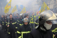 Firemen march as they protest with hospital staff on wages, working conditions and pensions, Tuesday, Oct. 15, 2019 in Paris. (AP Photo/Michel Euler)
