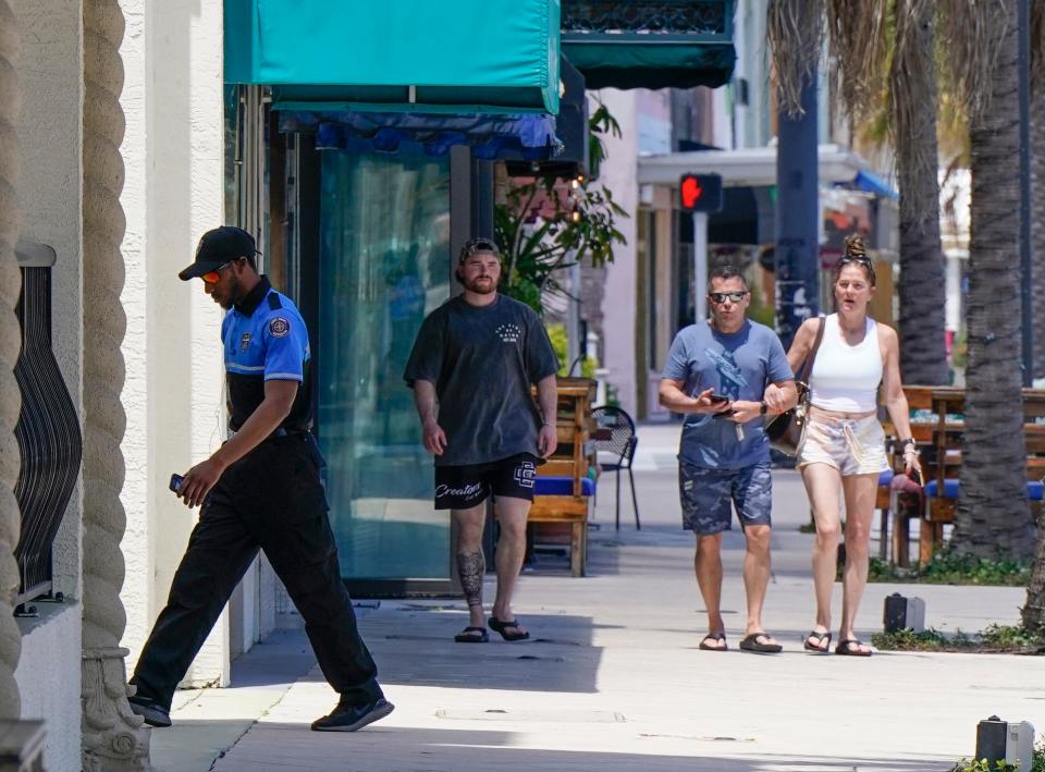 A downtown security guard walks Beach Street in Daytona Beach, Thursday, April 25, 2024.