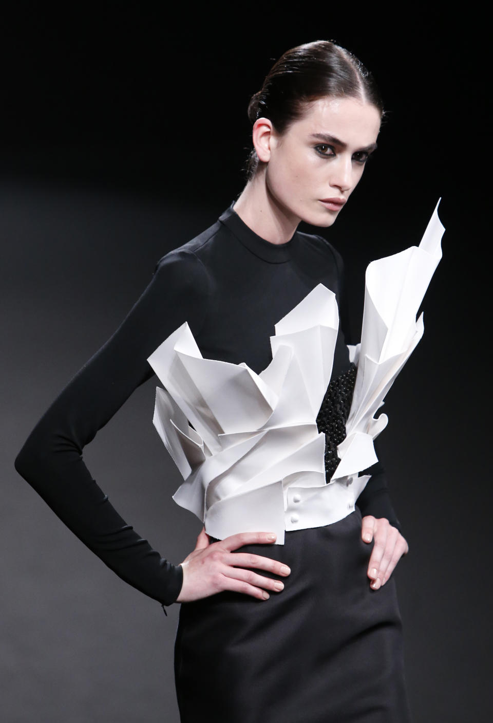 A model wears a creation by French fashion Stephane Rolland's Haute Couture Fall-Winter 2013-2014 collection presented Tuesday, July 2, 2013 in Paris. (AP Photo/Francois Mori)