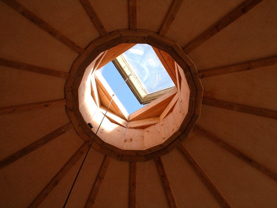 earthship in brighton skylight surrounded by wood