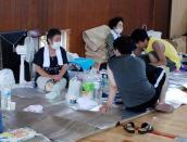 Local residents remain in a shelter on August 21, 2014, one day after a landslide hit a residential area in Hiroshima, western Japan