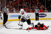 NEWARK, NJ - JUNE 09: Mike Richards #10 of the Los Angeles Kings goes for a loose puck as Andy Greene #6 of the New Jersey Devils hits the ice during Game Five of the 2012 NHL Stanley Cup Final at the Prudential Center on June 9, 2012 in Newark, New Jersey. (Photo by Bruce Bennett/Getty Images)